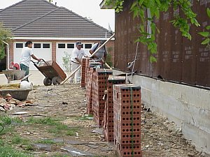 Preparing to lay the bricks.